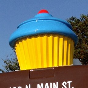 Giant cupcake on top of the Chocolate Moose cupcake delivery van Greenville SC