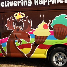 Closeup of left side of the Chocolate Moose cupcake delivery van Greenville SC